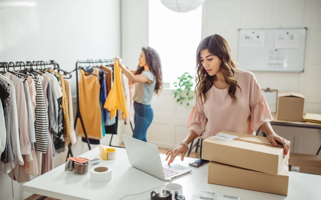 Girls from a small business preparing packages for orders received on Shopify eCommerce