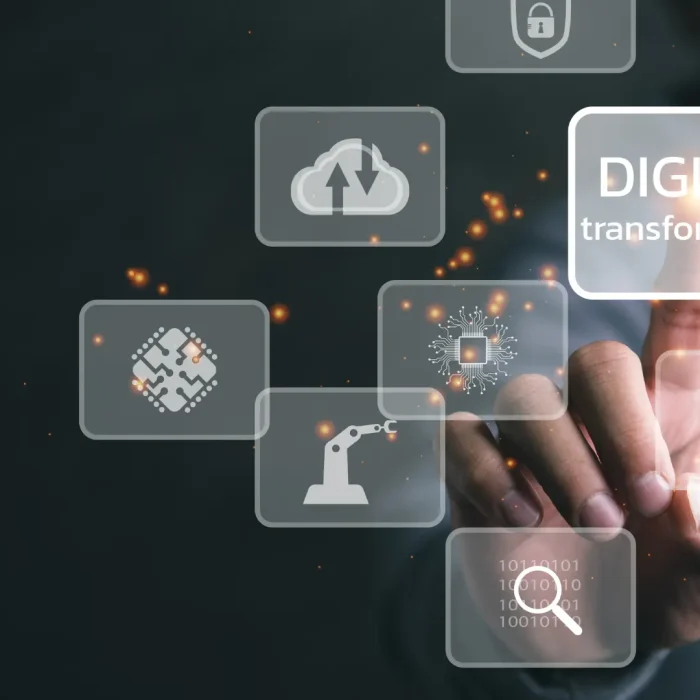 Hand touching digital interface with icons and "Digital Transformation" for business digitization
