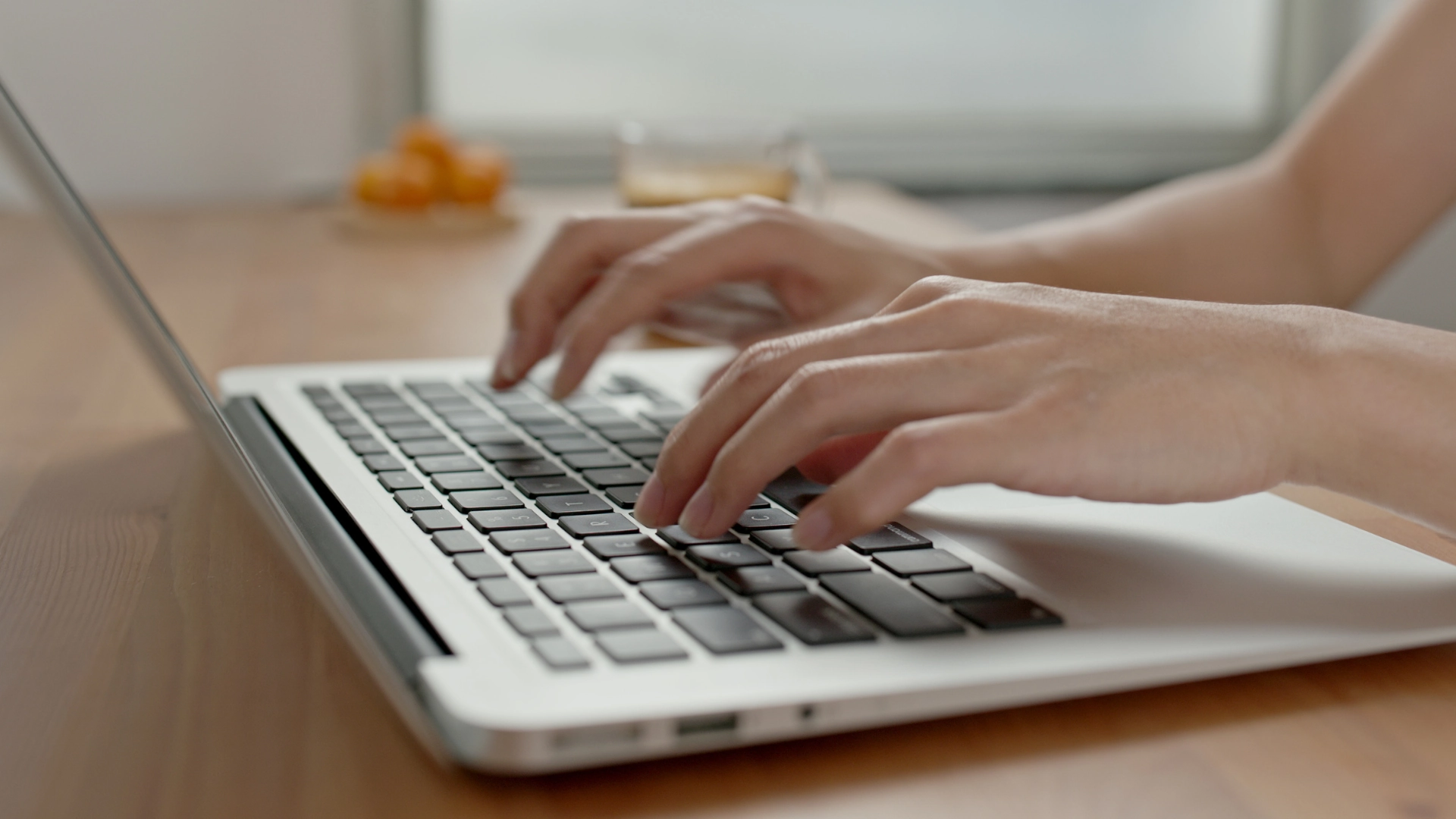 Typing hands on a laptop, symbol of digital work and content creation for the web